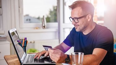 Person browsing on laptop